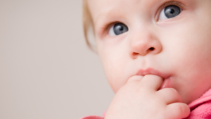 A child experiencing the effects of finger sucking. A condition that Daia orthodontics can help resolve. Improving smiles by correcting bad oral habits