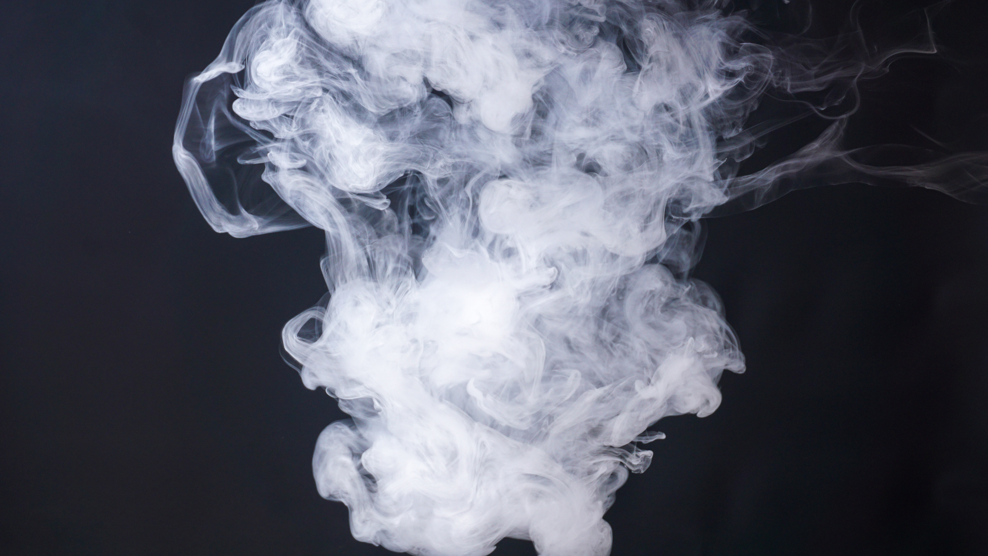 DAIA July Blog 1 2025 picture of smoke from vaping. This can cause malocclusion symptoms. Learn more about vaping and its impact on dental health