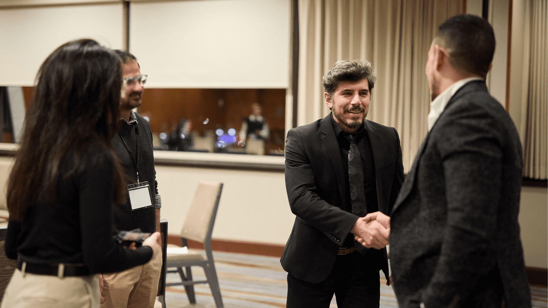 Dr. Daia shaking hands with people of Marquis Who's Who. Dr. Daia was being honored for their Tmj treatments and myofunctional therapy.