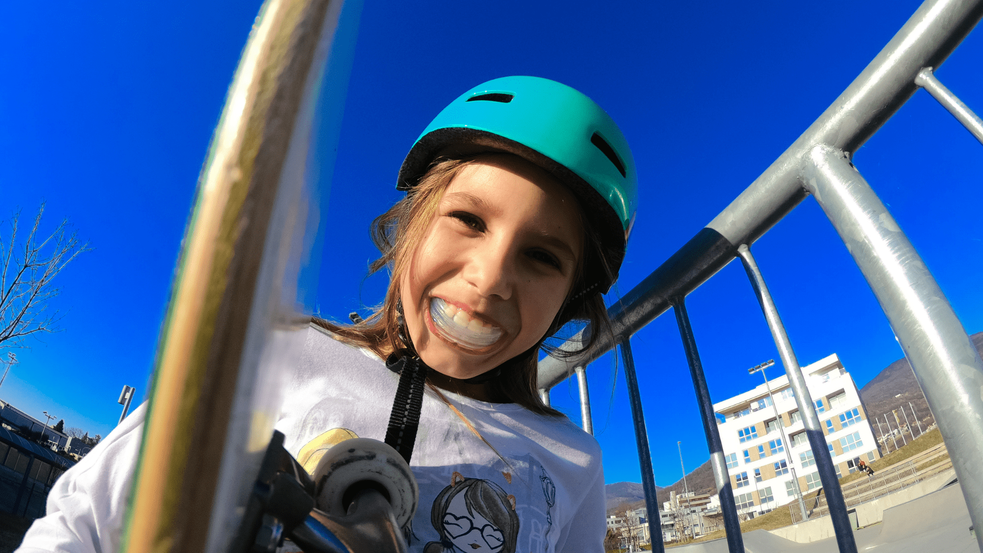 A child wearing a helmet and athletic mouthguard protecting teeth in Rochester MI