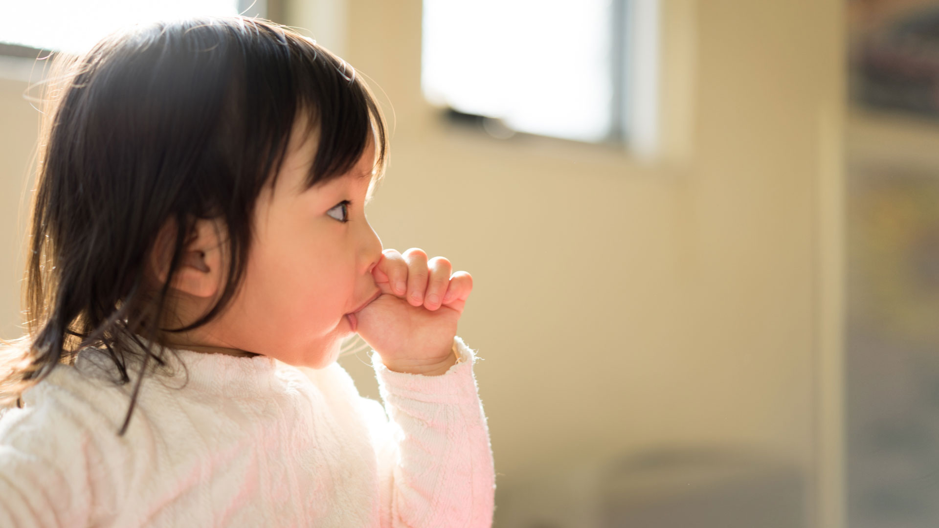 A Child Sucking thumb, this can lead to dental alignment and issues down the road.